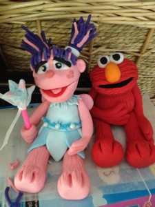 The bottom teir featured characters in coloured squares while 3D fondant toppers Elmo and Abby sat on top.