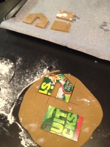 Roll out the gingerbread, place the templates on top and cut using a pizza wheel (a knife works but will drag the dough).