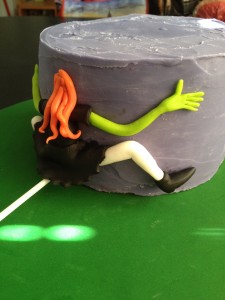 The bottom tier was covered in the purple ganache and had a witch planted into the front - she misjudged her landing.